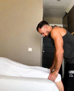 Outcall Massage in Istanbul therapist preparing a professional massage session in a hotel room